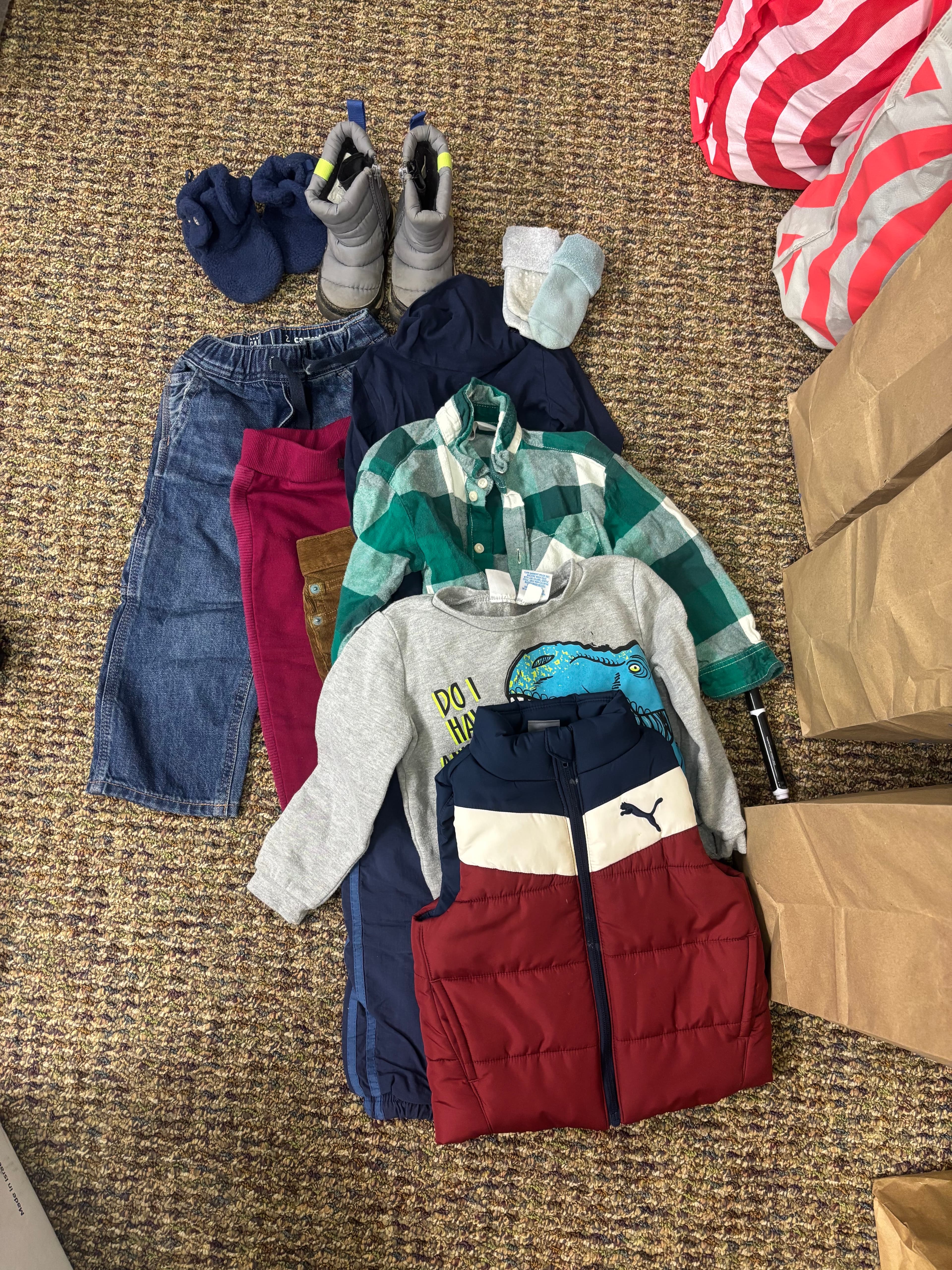 Curated bag of children’s clothes by size from the community closet